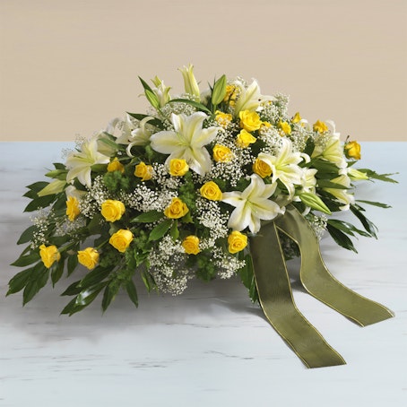 Cojín funerario amarillo